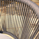 Close-up of a weave chair with grey ropes.