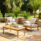Outdoor patio set with wooden chairs and table on a stone patio
