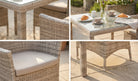 Outdoor furniture set with wicker chairs and table on a patio.