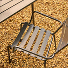 Metal chair on a gravel surface