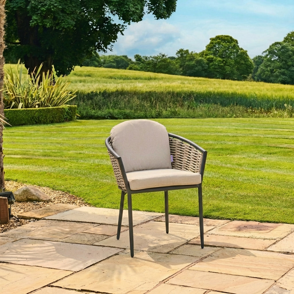 Chair with beige cushion on a patio in a garden setting