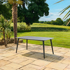 Pavilion Rectangular Black Dining Table on a Patio