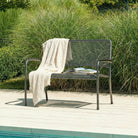 Metal 2-seater bench with a cream throw