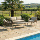Sofa lounge set consisting of a 2-seater, lounge chairs and coffee table on a patio. 