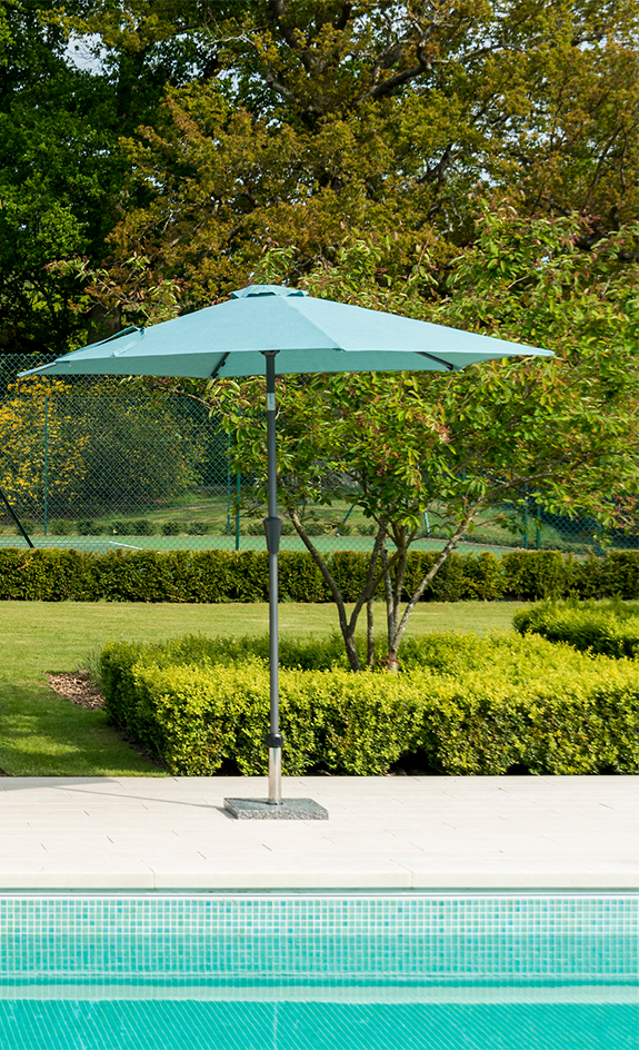outdoor umbrella open by pool