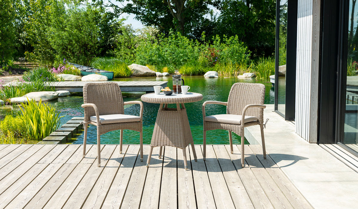 Hazelmere Stacking Armchair in natural weave with bistro table