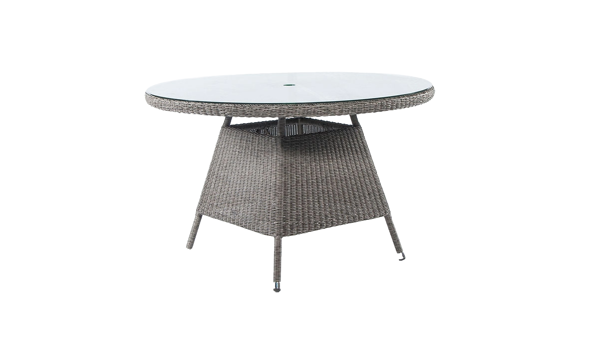 Round outdoor table with wicker frame and glass top on a white background