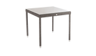 Square outdoor table with wicker frame and white glass top on a white background