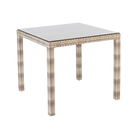 Square outdoor table with woven frame and glass top on a white background