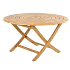 Wooden round folding table on a white background