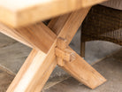 Close-up of dining table legs in a cross shape