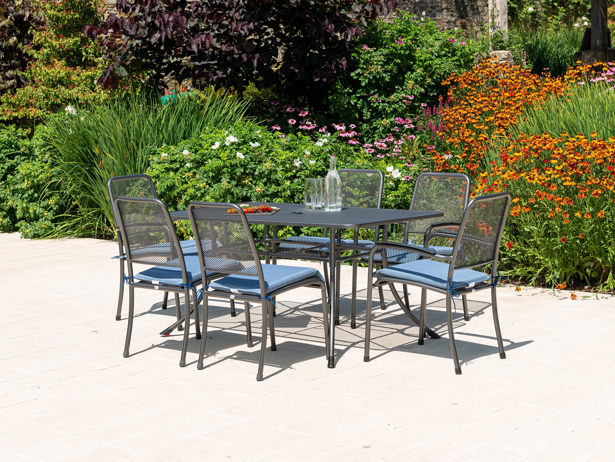 garden table and chairs with food