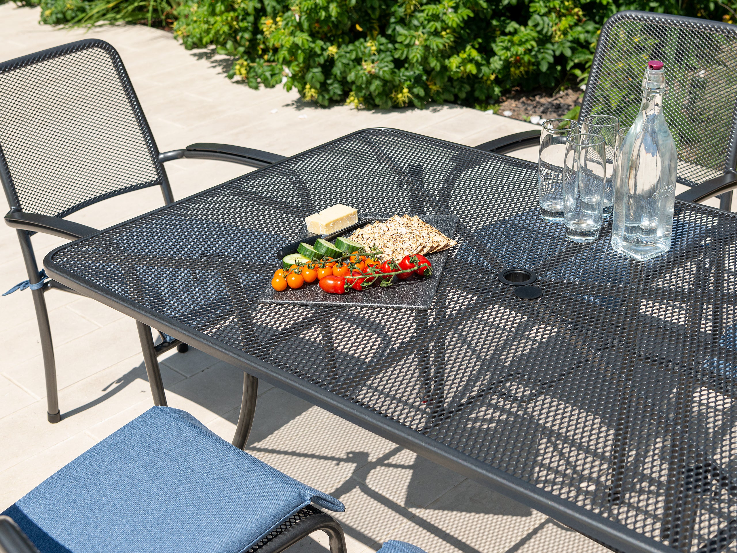 close up of garden metal table with food