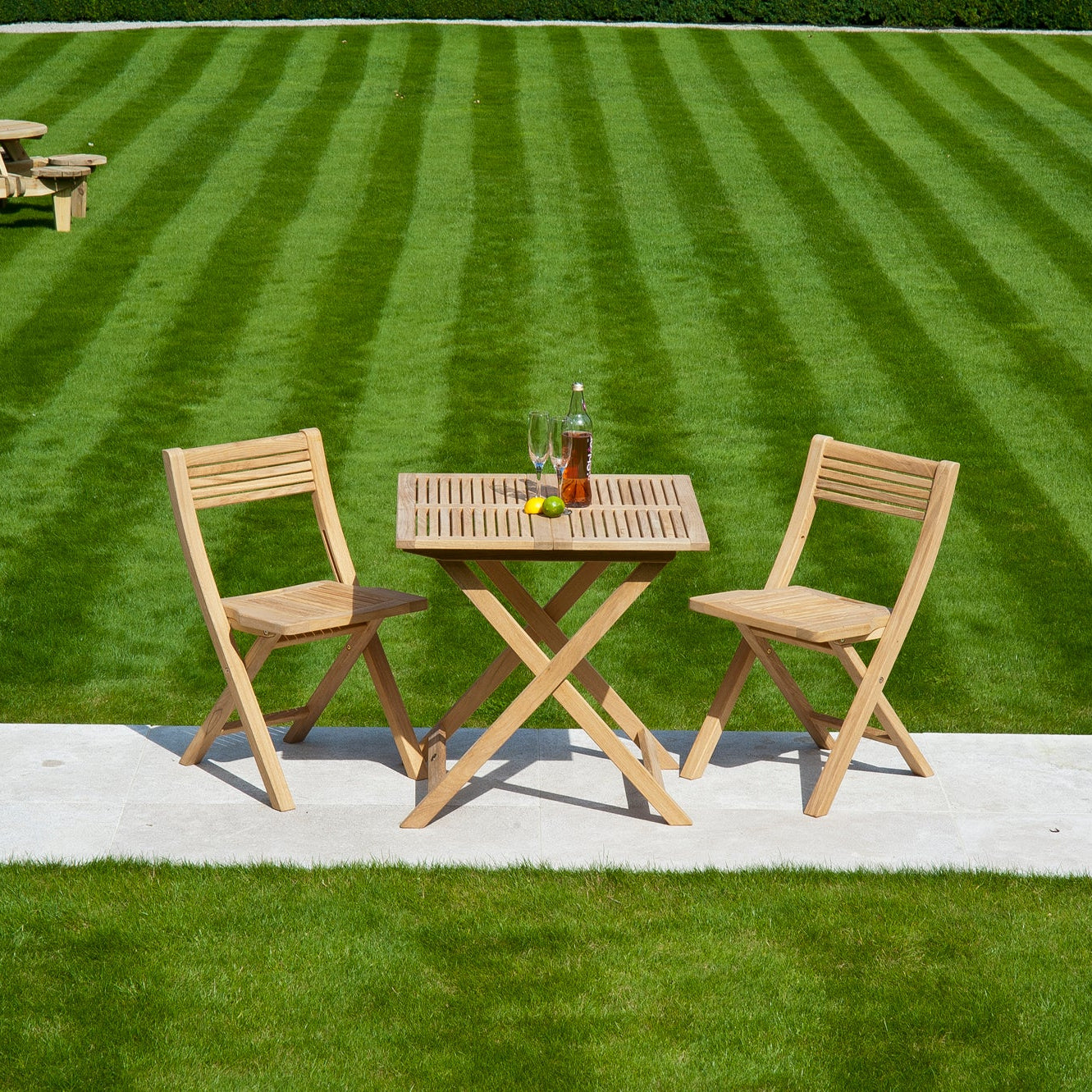 Roble Folding Chair Lifestyle by Alexander Rose