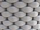 Close-up of a textured woven pattern in grey tones