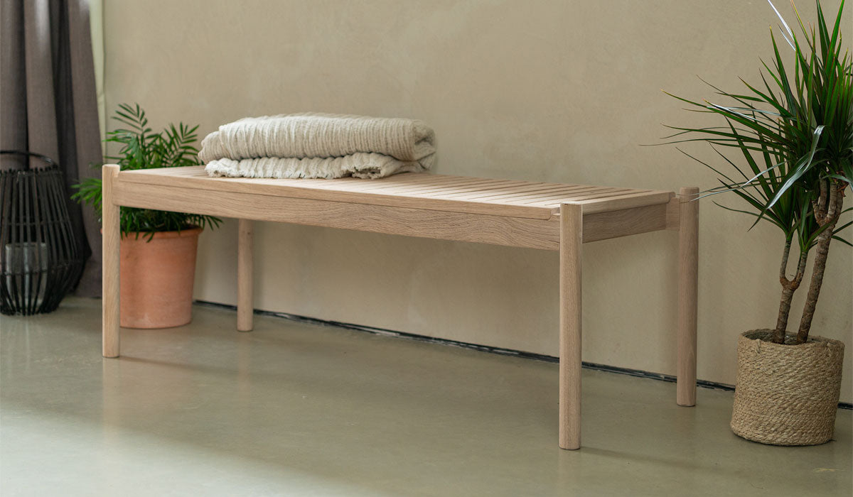 trak bench in hallway with throw